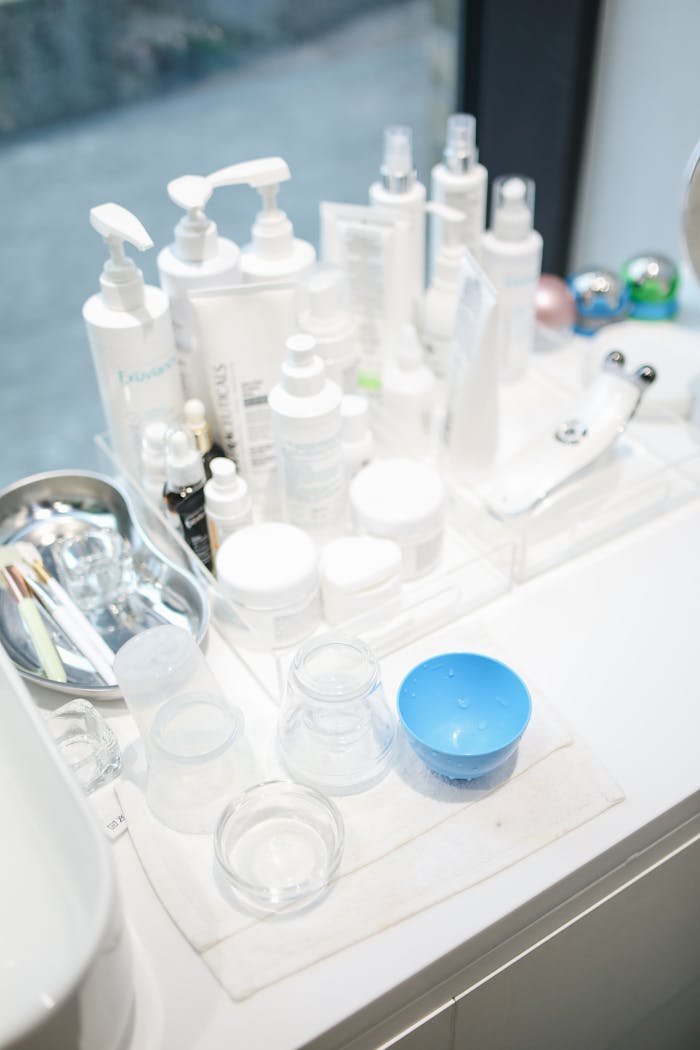 who-we-are A clean and organized display of skin care products and beauty tools in a salon setting.